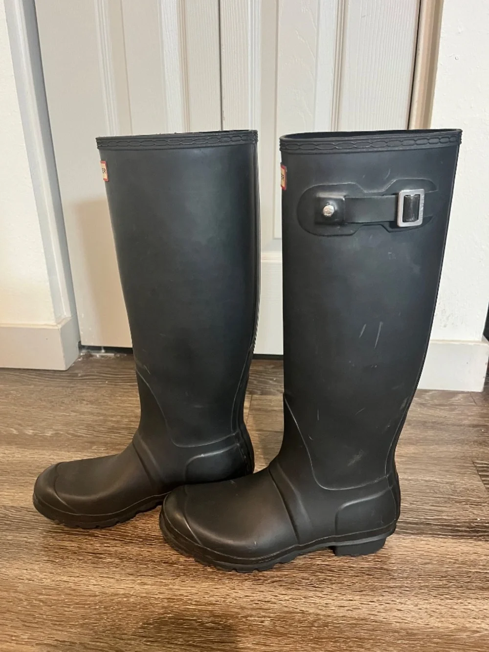 Women’s tall black hunter boots with socks